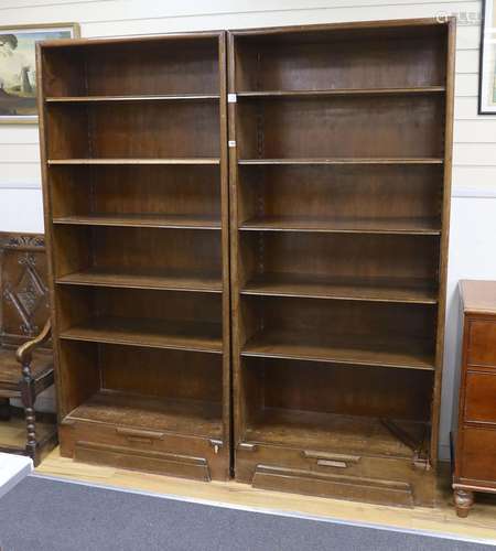 A pair of Hungarian mahogany and pine open fronted bookcases...