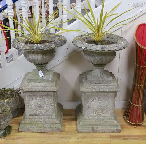 A pair of reconstituted stone campana garden urns on square ...