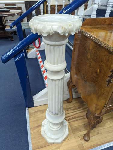 A carved alabaster pedestal on octagonal base, height 108cm