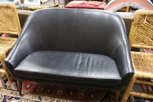 A mid century design black leather tub framed settee, length...