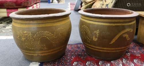 Two Chinese style circular glazed terracotta garden planters...