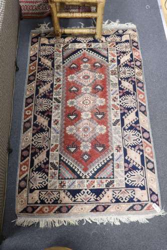 A Caucasian red ground rug and a Bokhara runner, rug 180 x 1...