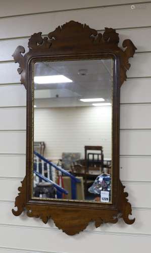 A George III style mahogany fret cut wall mirror with gilt s...