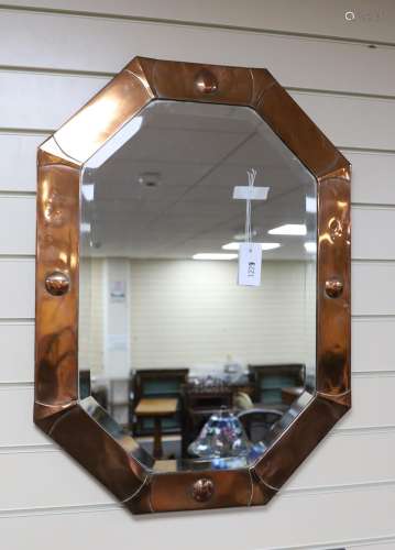 An Arts and Crafts octagonal copper wall mirror width 54cm, ...