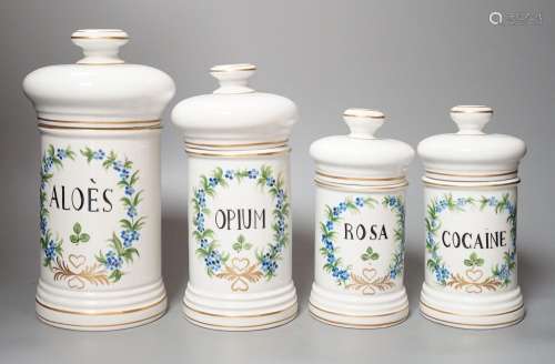 Four graduated porcelain apothecary jars - tallest 26cm