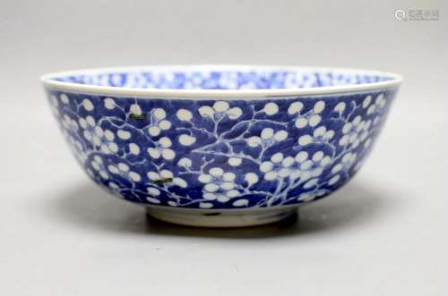 A Chinese blue and white prunus bowl, 19th century. 26.5cm d...