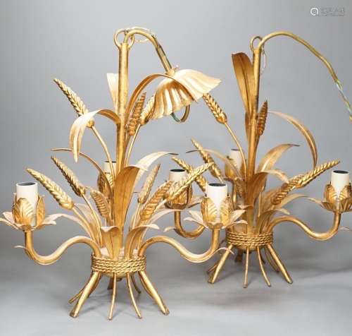 A pair of gilt metal wheat sheaf three light chandeliers