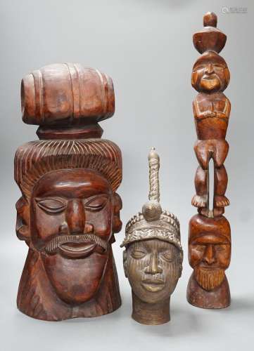 A metal Benin style bust, a carved tribal bust and another