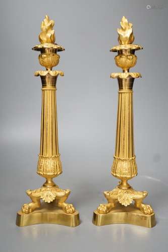 A pair of Louis XVI style ormolu candlesticks with torched s...