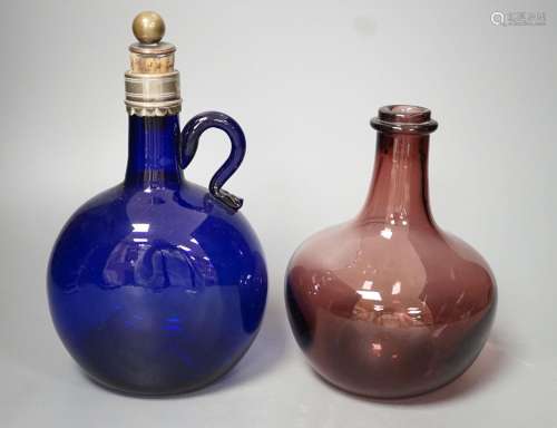A Victorian blue glass claret jug and an amethyst glass bott...