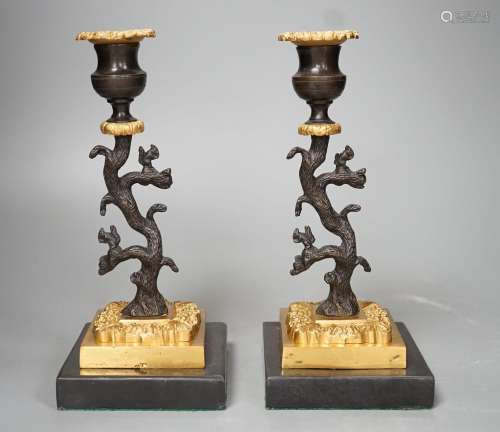 A pair of bronze and ormolu tree candlesticks - 22.5cm tall