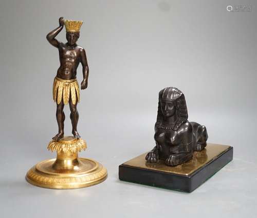 A patinated metal model of a sphinx and a bronze and gilt fi...