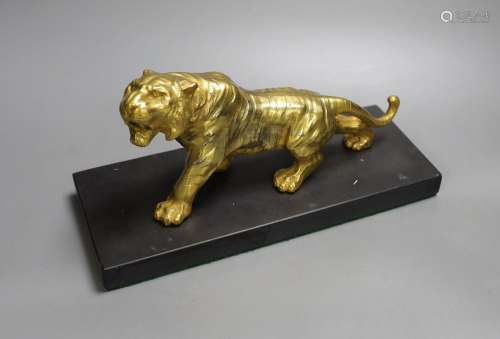 A gilt bronze figure of a tiger on base - 13cm tall