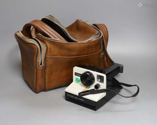 A Polaroid card camera in brown leather case