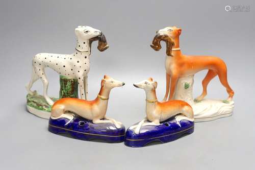 Two Staffordshire greyhounds and a pair of recumbent Staffor...