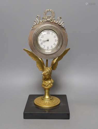 A gilt metal 8 day ‘eagle’ desk timepiece with marble slab b...