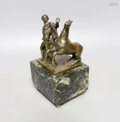 A Roman style bronze of a man and horse on a marble base 17c...