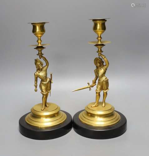 A pair of gilt metal ‘cavalier’ figural candlesticks, 24cm