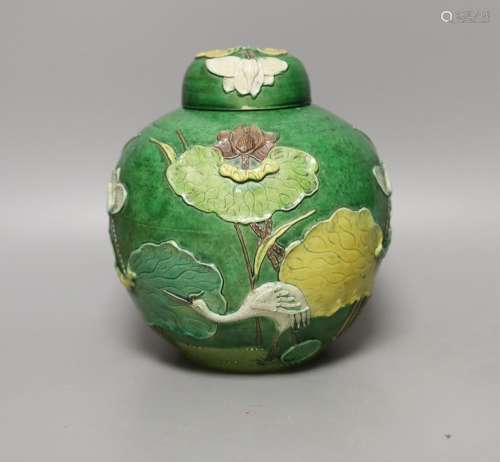 An early 20th century Chinese green-glazed ‘lotus’ jar and c...