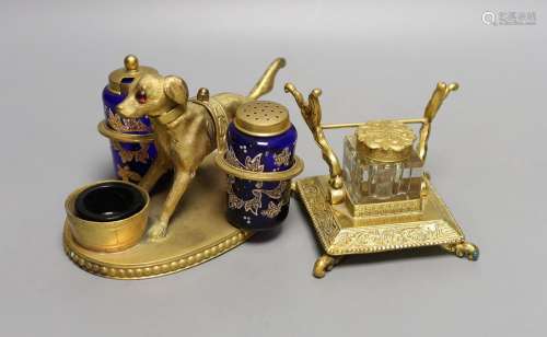 A gilt metal ‘dog’ desk stand together with a similar French...