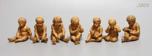 A group of seven terracotta figures of playful youths