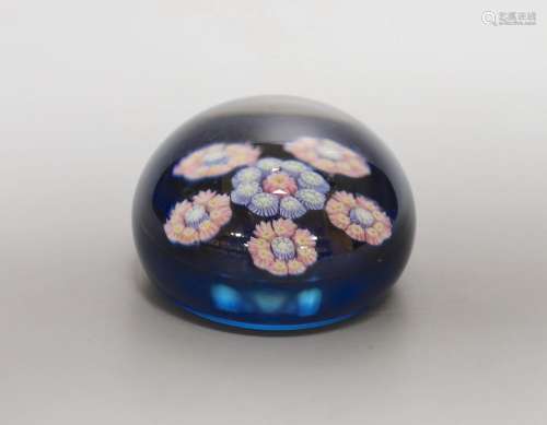 A small Perthshire blue ground millefiori glass paperweight ...