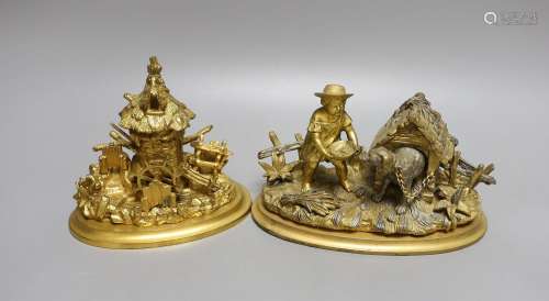Two ormolu inkwells modelled as a dog in a kennel and a wate...