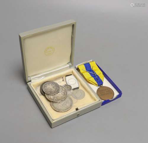 A group of silver medallions and silver coins including two ...
