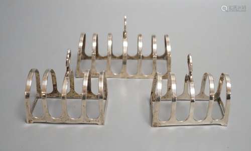 A matched suite of three silver toastracks, pair by Adie Bro...