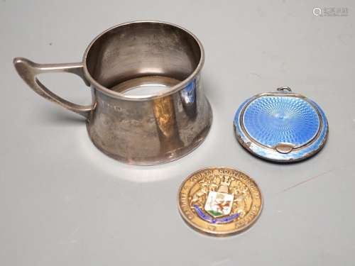 A George V silver cup holder, Birmingham, 1918, a silver and...