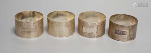 A set of four George VI engine turned silver napkin rings, H...