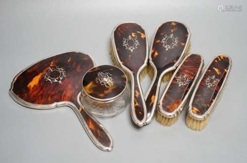 A George V silver and tortoiseshell mounted mirror and brush...