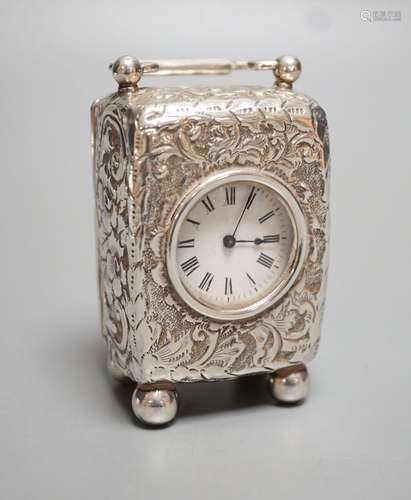 A late Victorian embossed silver cased miniature carriage ti...