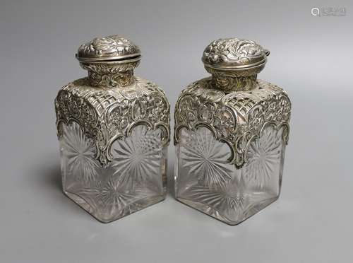 A pair of late Victorian repousse silver mounted cut glass s...