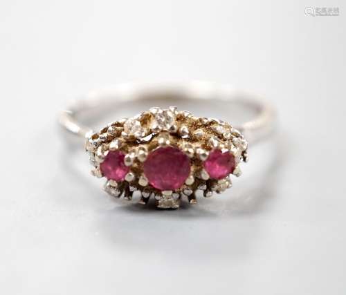 A modern 18ct white gold ruby and diamond set cluster ring, ...