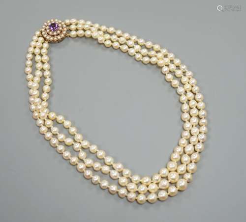 A triple strand cultured pearl choker necklace, with a yello...