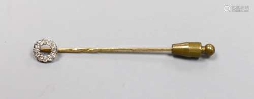 An Edwardian yellow metal and diamond cluster set stick pin,...