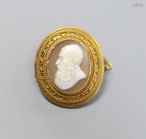 A late Victorian yellow metal and oval cameo shell set brooc...