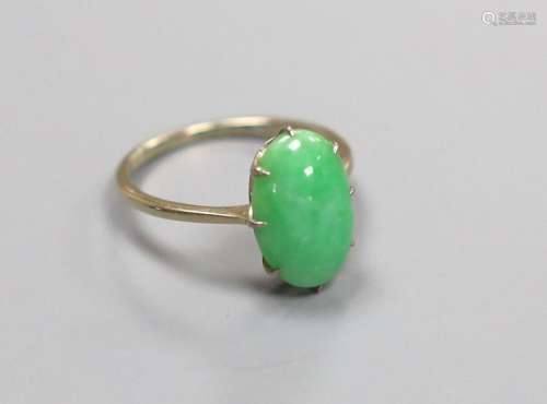 A white metal and oval cabochon jade set ring, size L, gross...