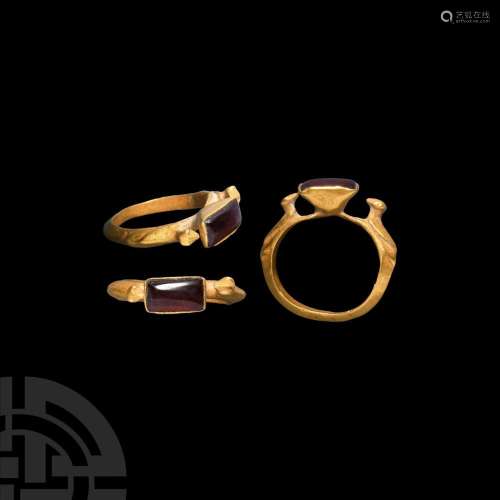 Gold Ring with Birds and Garnet