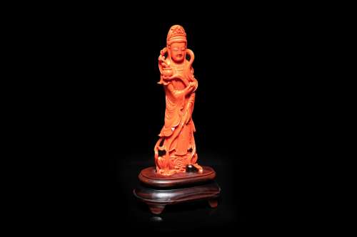 A Chinese carved red coral 'Guanyin' figure, 19/20th C.