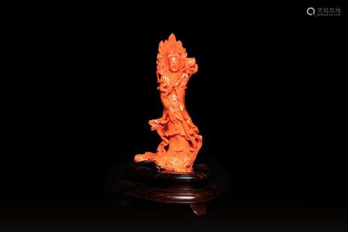 A large Chinese carved red coral 'Guanyin' figure, 19/20th C...