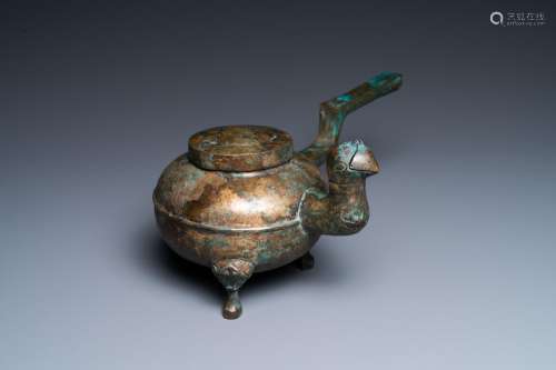 A Chinese gilt bronze tripod 'He' kettle with bird head-shap...