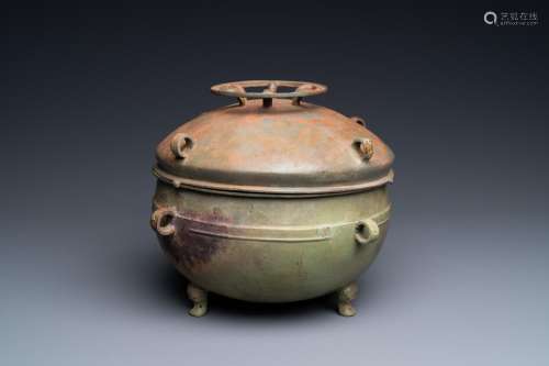 A Chinese bronze ritual tripod 'zhan' food vessel and cover,...