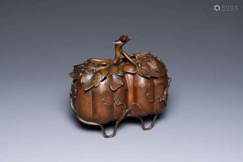 A Chinese bronze censer and cover in the shape of two pumpki...