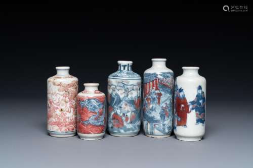 Five Chinese blue, white and copper-red snuff bottles, 18/20...
