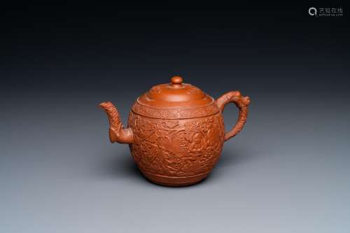 A Chinese Yixing stoneware teapot with boys among peony scro...