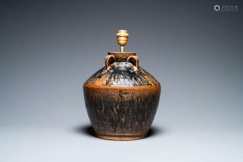 A Chinese brown-spotted black-glazed jar transformed into a ...