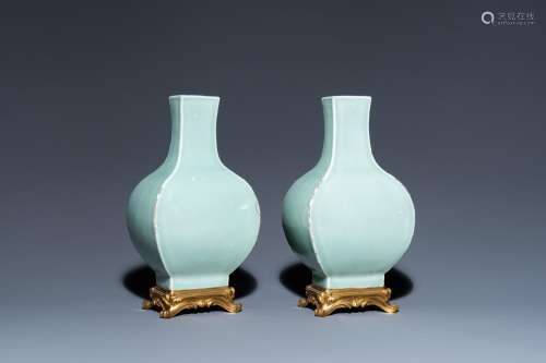 A pair of Chinese monochrome celadon vases with gilt bronze ...