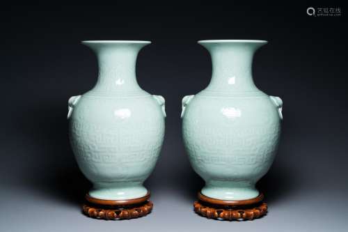 A pair of Chinese monochrome celadon vases with underglaze d...